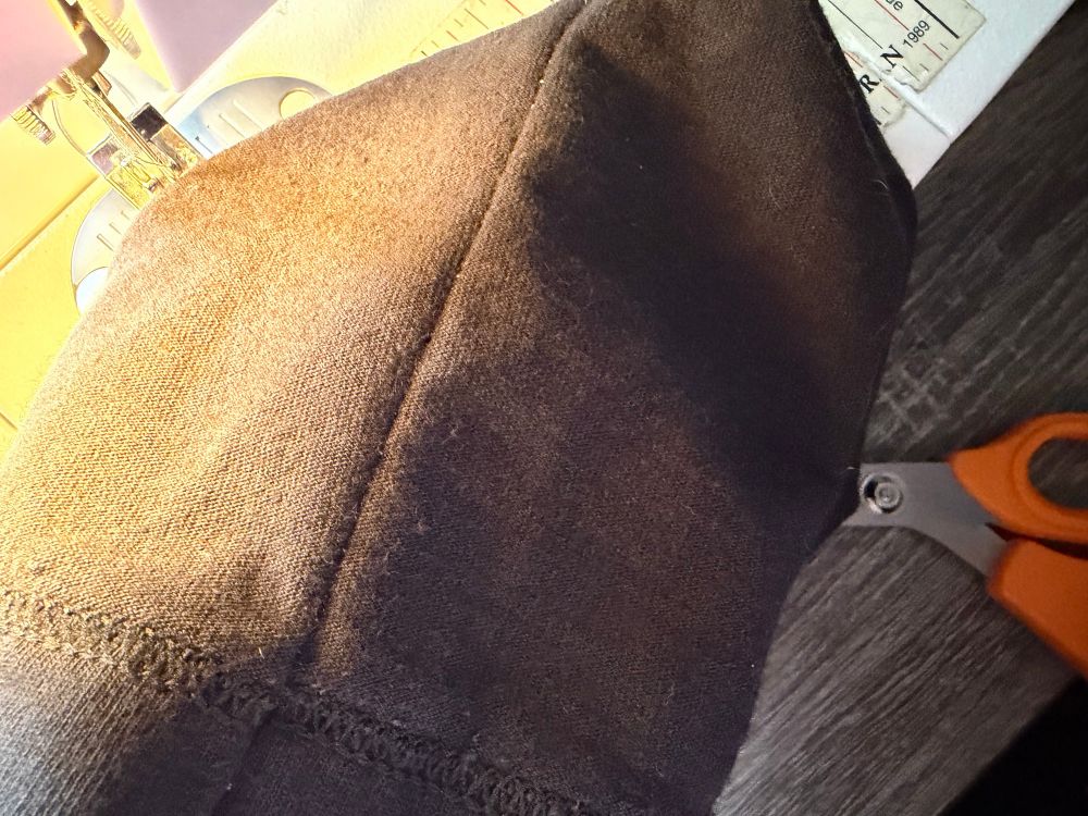 Black jersey fabric with a straight seem.
