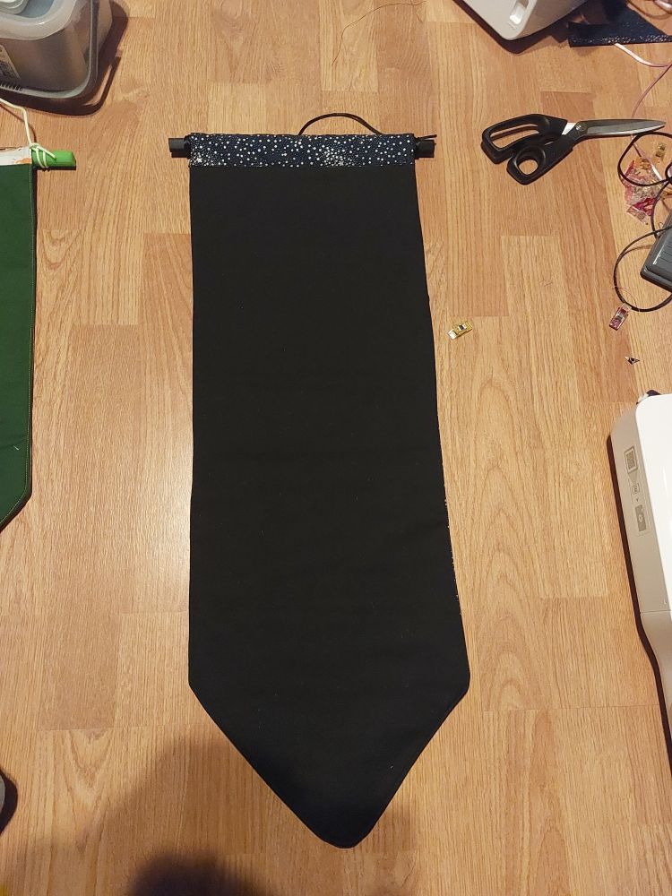an extra large pin banner with a black front, it is approximately 75cm long