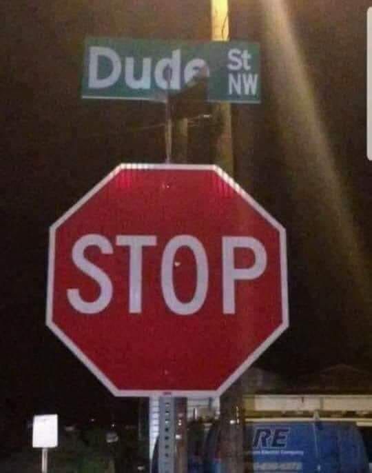 It's a place sign for Dude
above a Stop sign