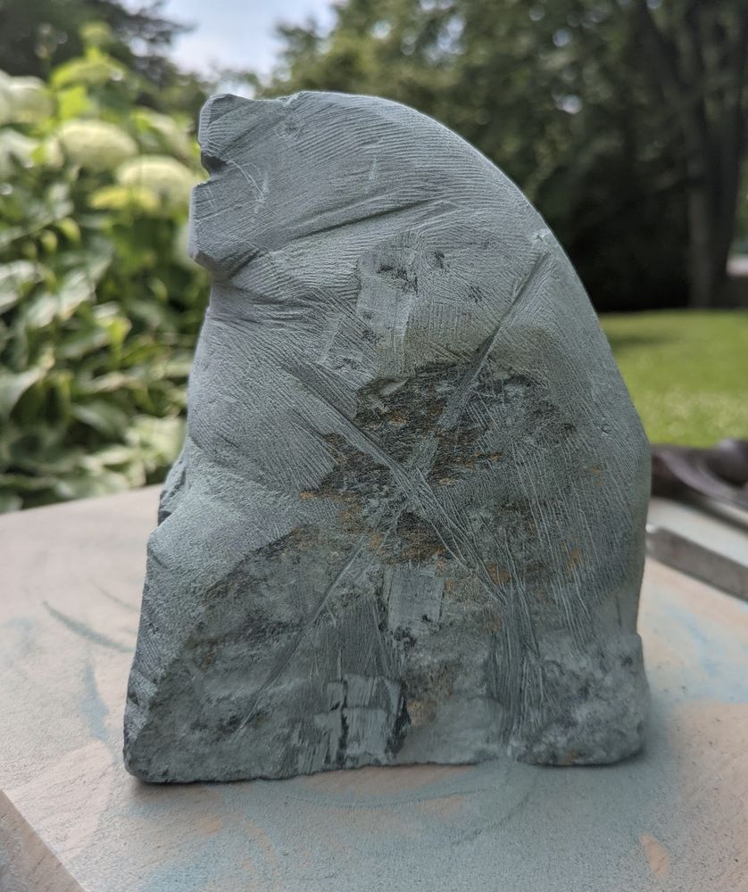 Rough grey stone carving of indeterminate shape