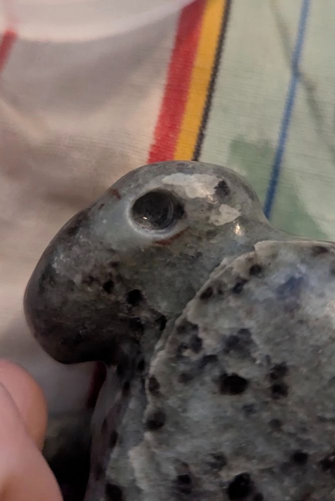 photo of a small hole drilled into some smooth blue soapstone