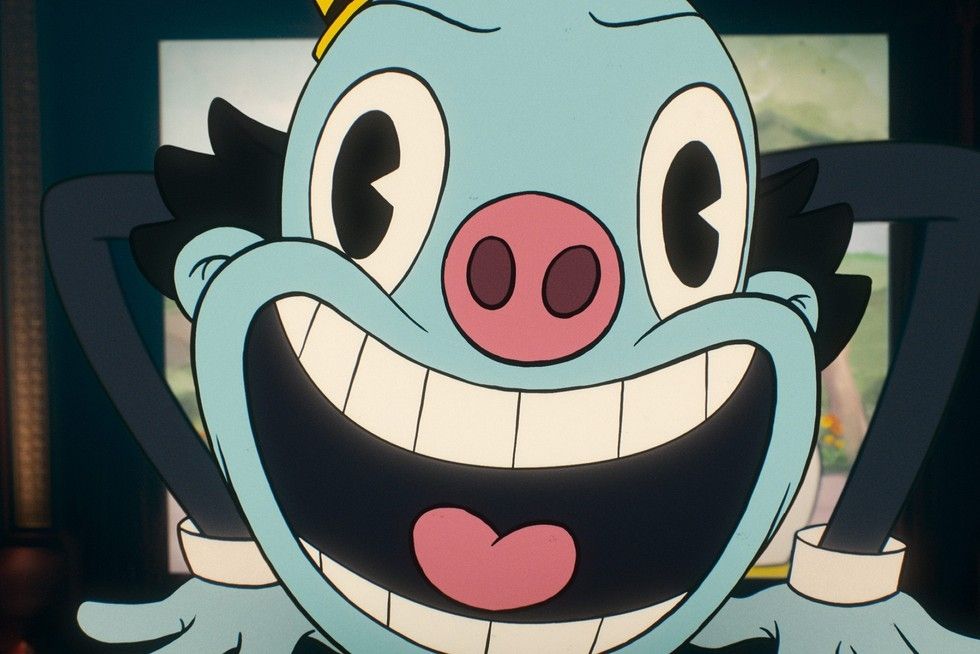 The bright blue face of the creepy cartoon Mr Ring-a-Ding. Complete with wide eyes and piggy nose.