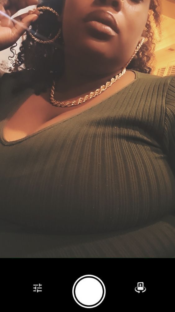 Pretty Black woman wearing gold jewelry