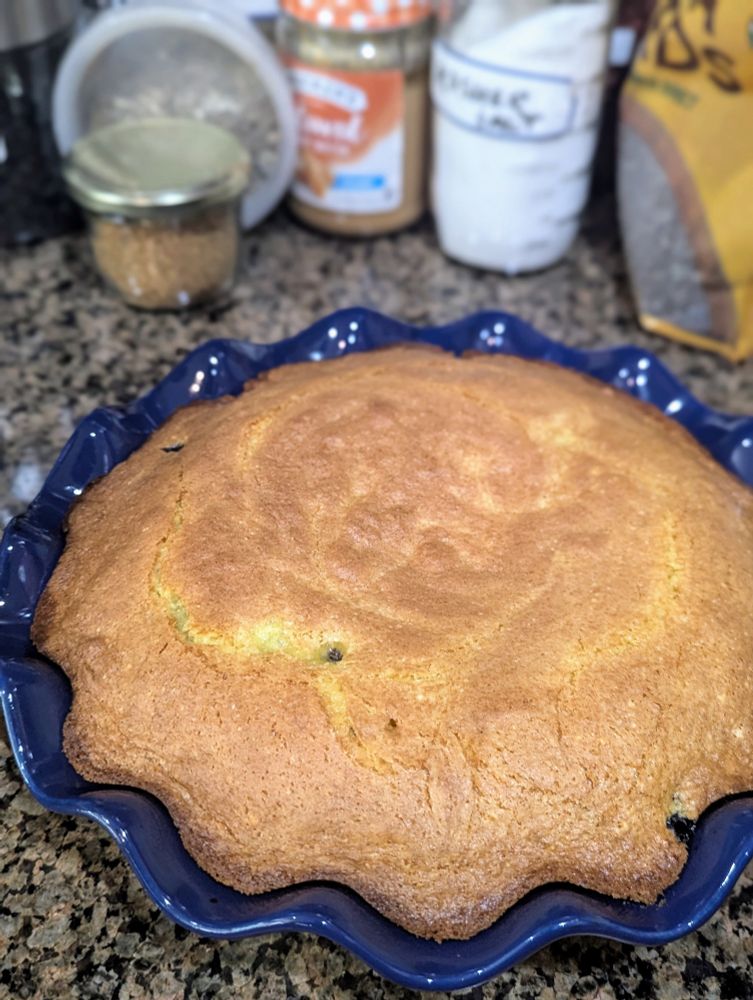 Cooked lemon blueberry pound cake on a counter cooling