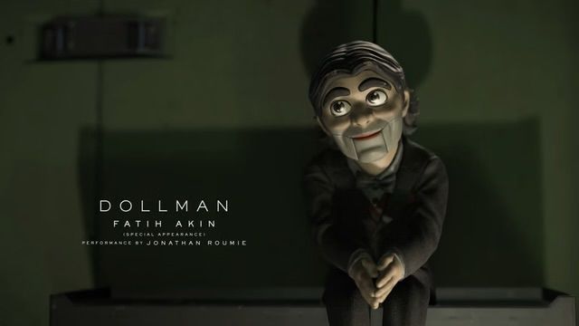 Photo of Dollman from death stranding 2 

DOLLMAN - FATIH AKIN
Performance by Jonathan Roumie
