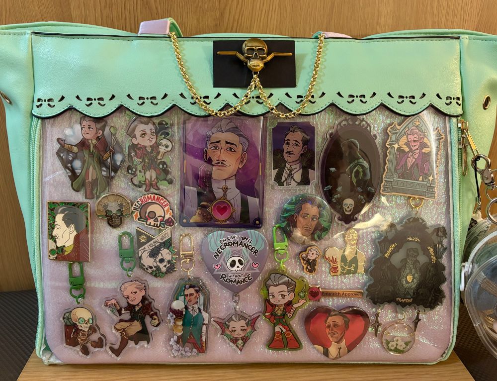 an itabag filled with merch of emmrich volkarin from dragon age the veilguard