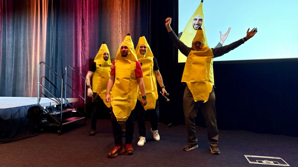 Pablo Galindo, myself, Yury Selivanov, and Guido van Rossum in banana suits.