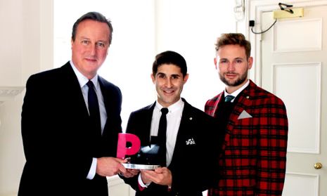 David Cameron being awarded a pink P award.