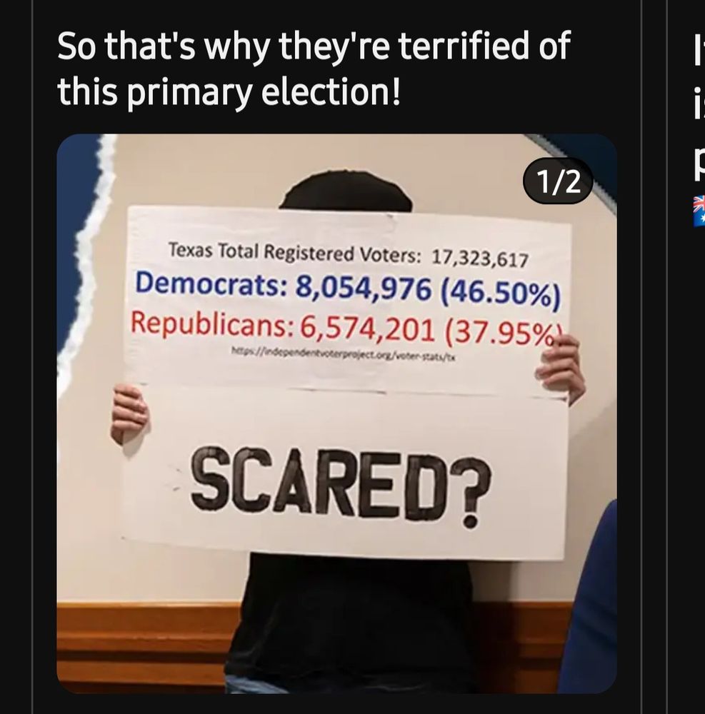 A man holding a sign that says "scared" and pointing out that there are more registered Democrats than Republicans in Texas.