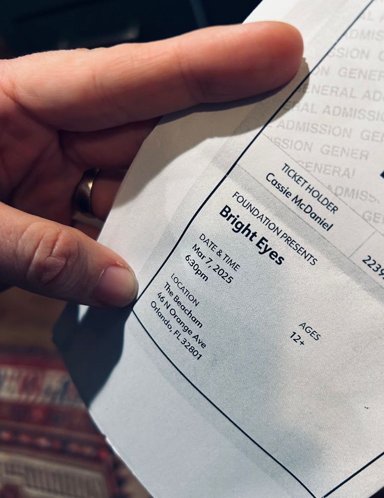 Holding a Bright Eyes tickets