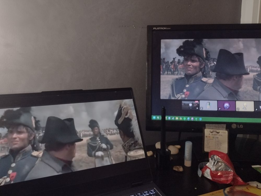 Photo of my laptop and second monitor, both playing Waterloo (1970). The laptop is markedly lower resolution BC I'm watching the YouTube upload.