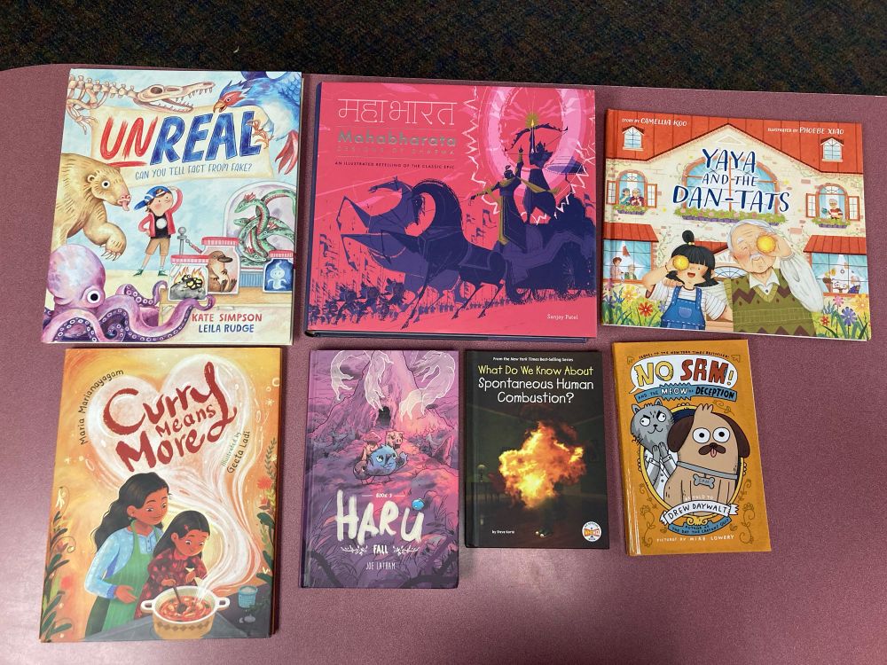 Seven new releases that will be added to our library collection. Titles include:
Unreal: Can You Tell Fake From Fact?
Yaya and the Dan-Tats 
Mahabharata: Designs of Dharma
Haru Book 3: Fall
No Sam! And the Meow of Deception
What Do We Know About Spontaneous Human Combustion? 