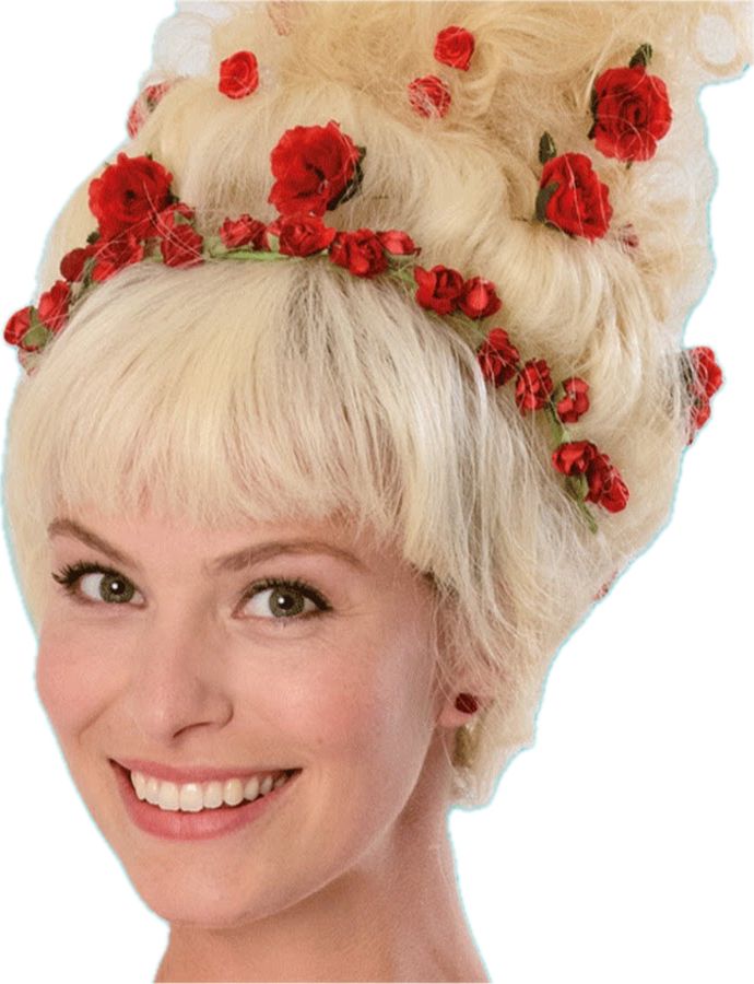 foto apenas do pescoço pra cima, sem nenhum fundo, da cantora holandesa Juf Roos. É uma mulher branca, loira, de olhos verdes. O cabelo está penteado num grande coque para cima com flores vermelhas formando uma tiara e espalhadas por todo o cabelo, tem uma franja na testa. Ela está olhando levemente de lado e sorrindo.