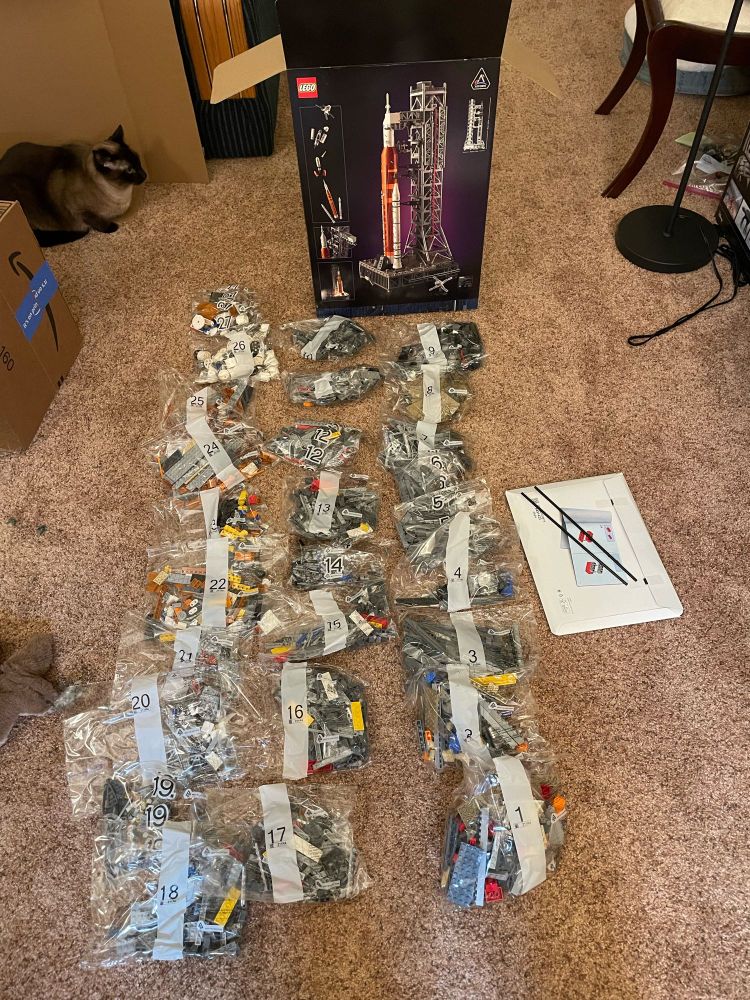 27 bags of unassembled legos and the box they came in