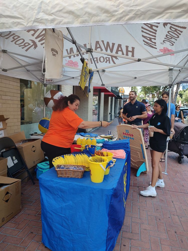 A sidewalk booth with swag.