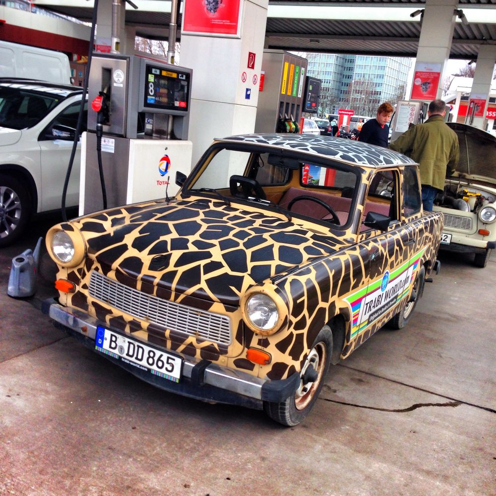 An old Trabant car decorated in a giraffe-print pattern 