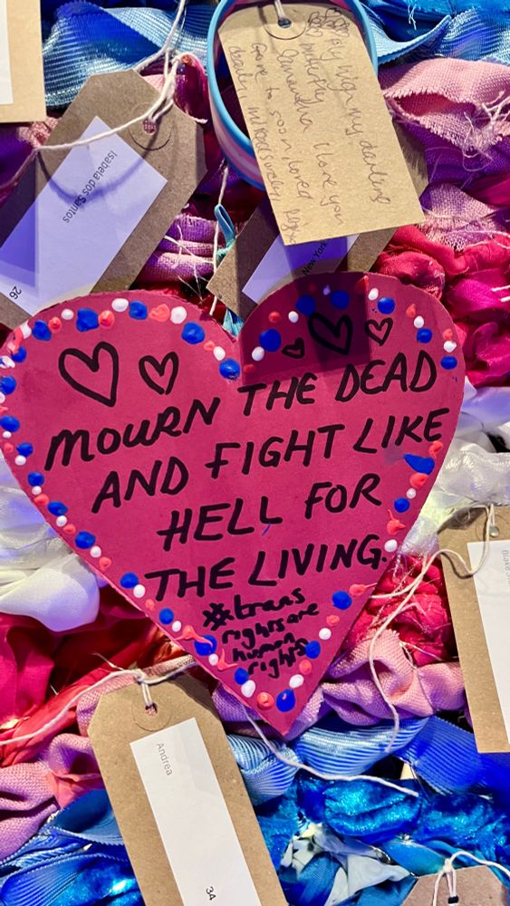 A heart shaped label with the text ‘Mourn the dead and fight like hell for the living’. 