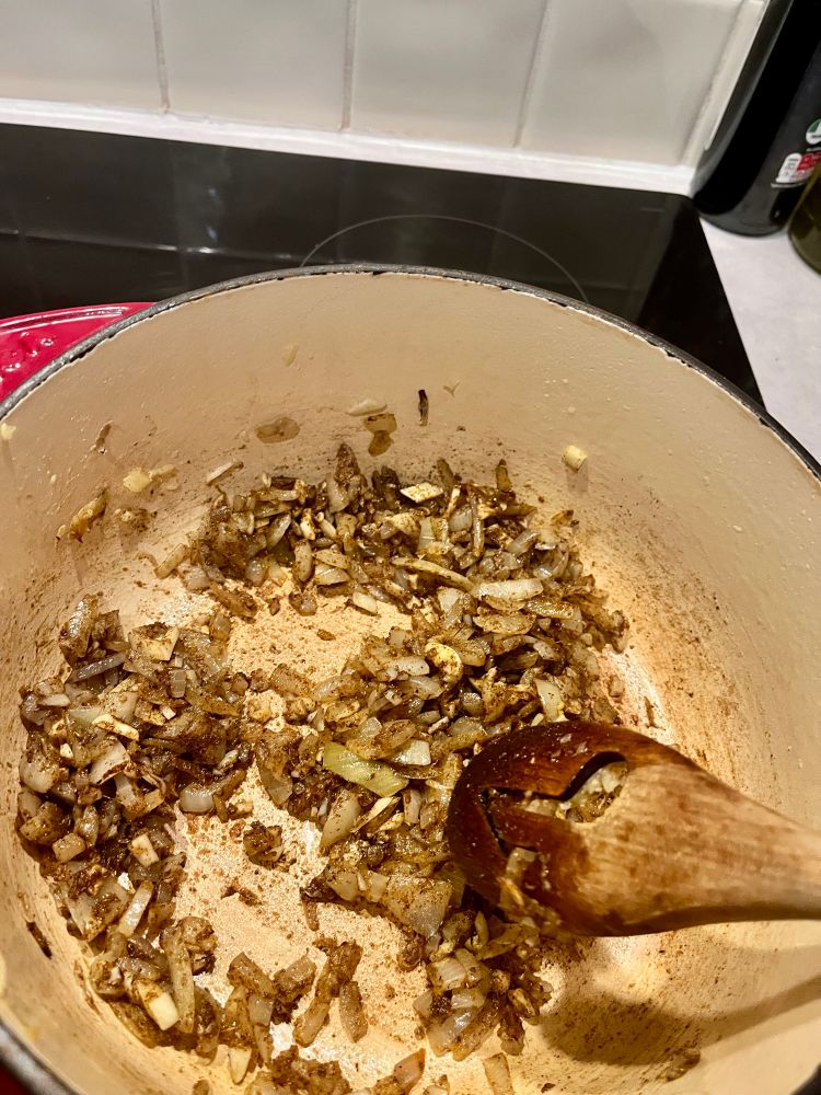 Onions frying with the spices. 