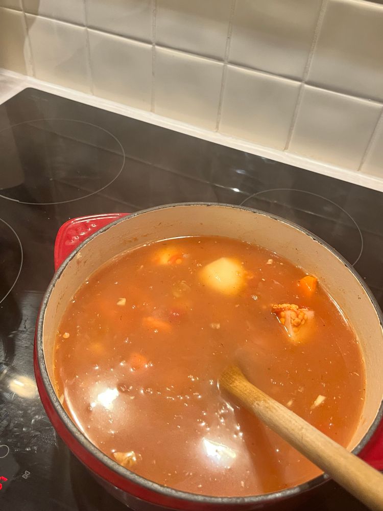 The cooking pot topped up with stock. 