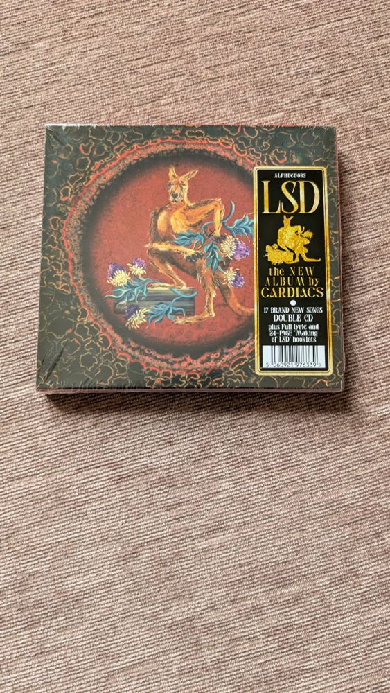 The CD of the new Cardiacs album, LSD.