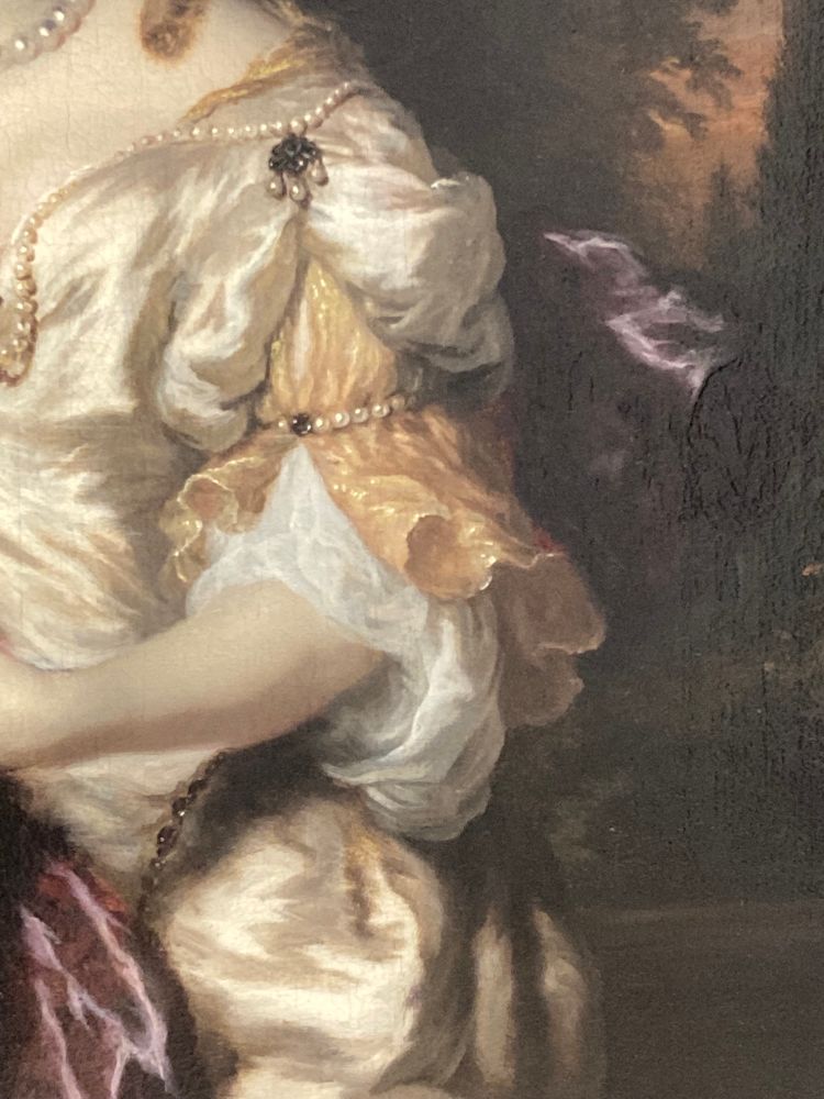 A portion of Portrait of a Lady, 1677 by Nicolas Maes, cropped to show the subject’s three layered sleeve that goes down to the elbow. It goes from an opaque pearly white fabric to flowy, semi-sheer peach and white fabrics. The peach layer’s hem furls irregularly and the artist has done an exceptional job portraying the highlights with thin lines of gold paint