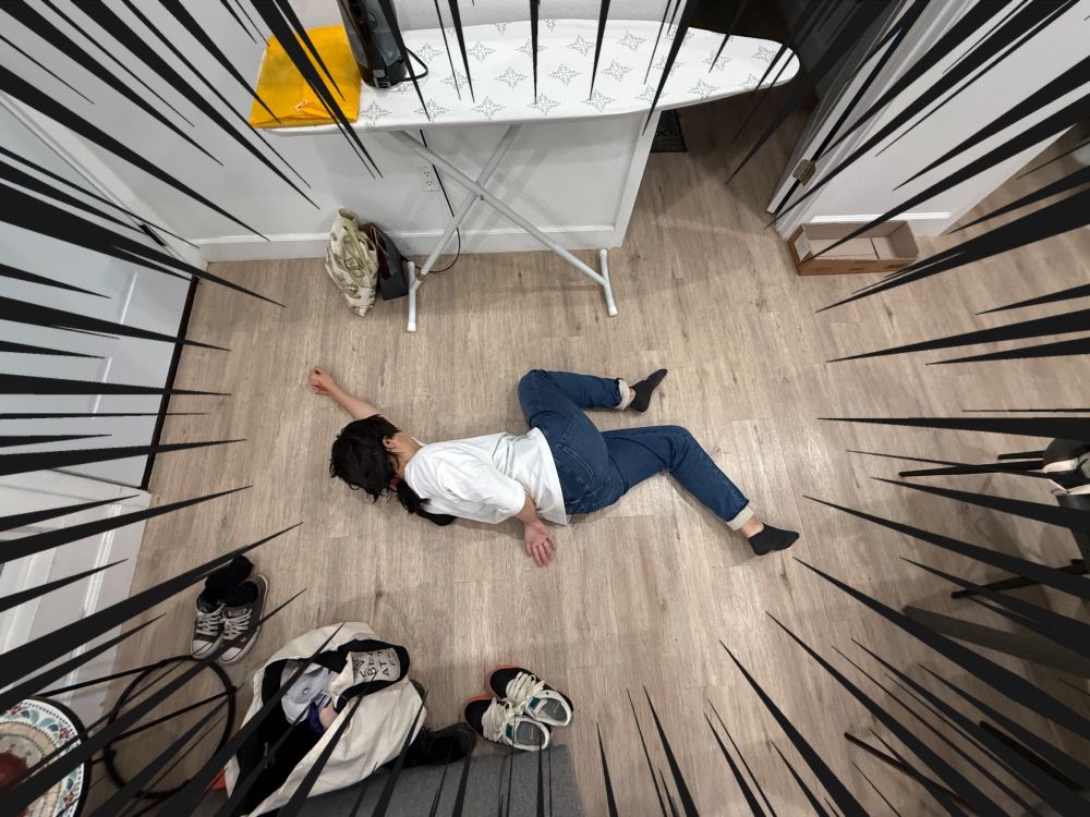 A top-down photo of V cosplaying as Iori from Fate/Samurai Remnant in his casual summer outfit (white t shirt and blue jeans) sprawled on the floor, body contorted like in the dying in a glue trap meme. Black action lines around the perimeter of the image emphasize the shocking discovery of this possible murder scene