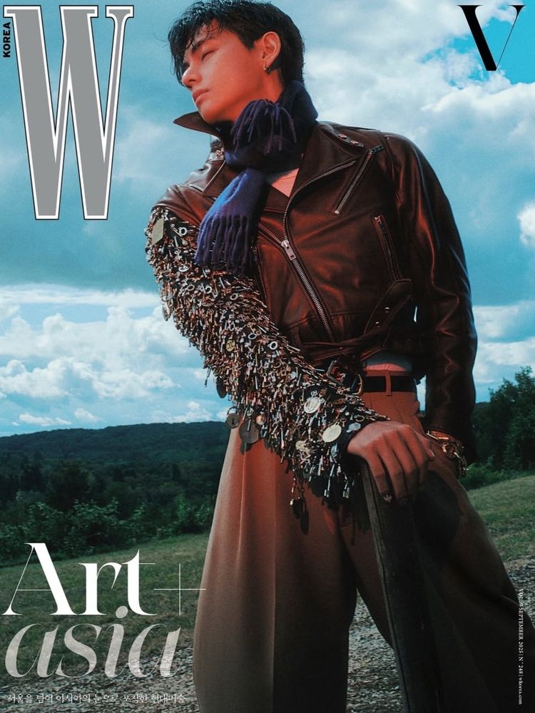 V on the cover of W magazine. wearing a leather jacket that has one sleeve full of little metal dangly trinkets