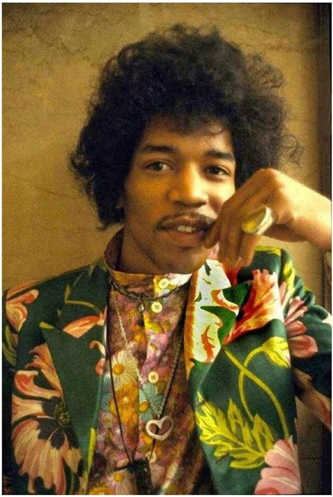 jimi hendrix in green and pink floral
jacket