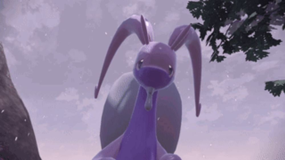 a purple rabbit with long ears is standing next to a tree in the snow .