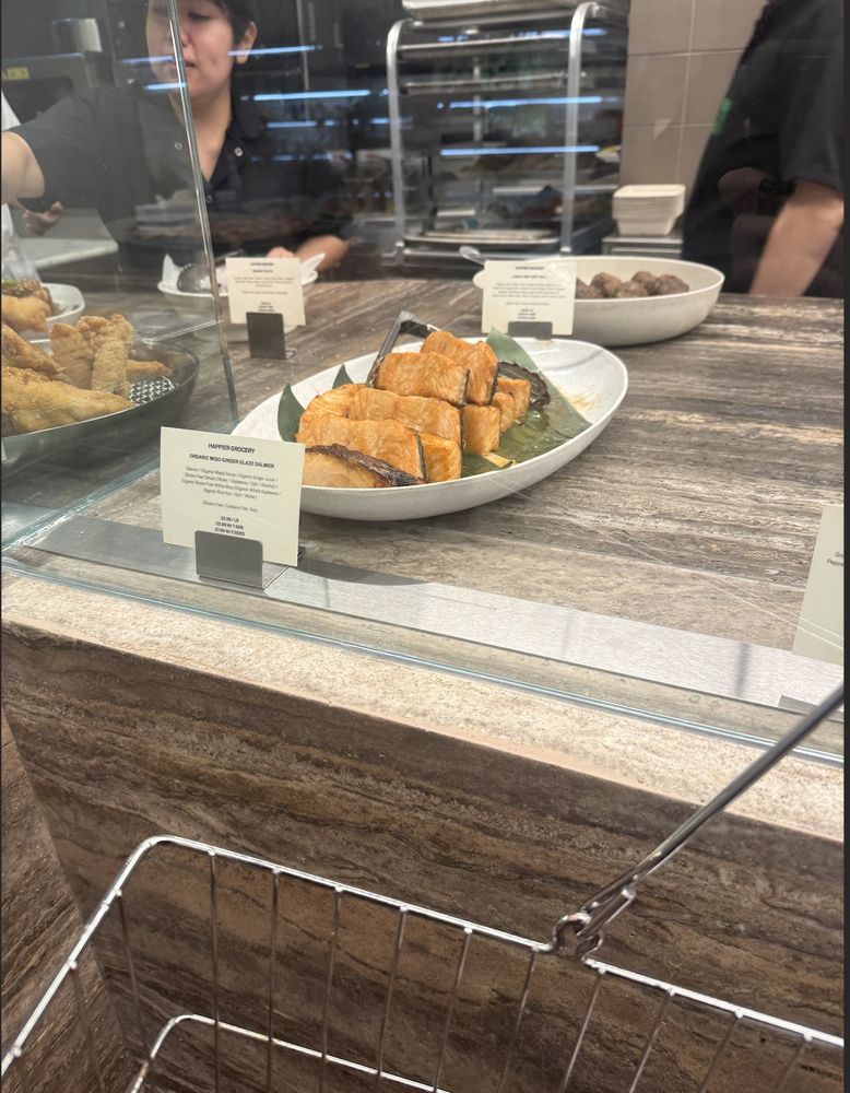 cooked salmon at happier grovery. it's on a platter and just out, unrefrigerated, at room temp.