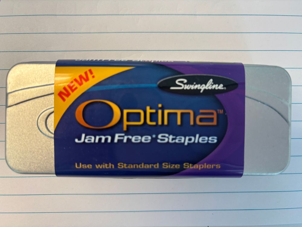 Picture of Swingline Optima staples container with label stating “Jane Free Staples”. 