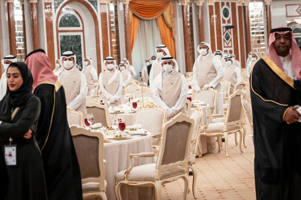 masked waiters ready to serve lunch for Trump and MBS 