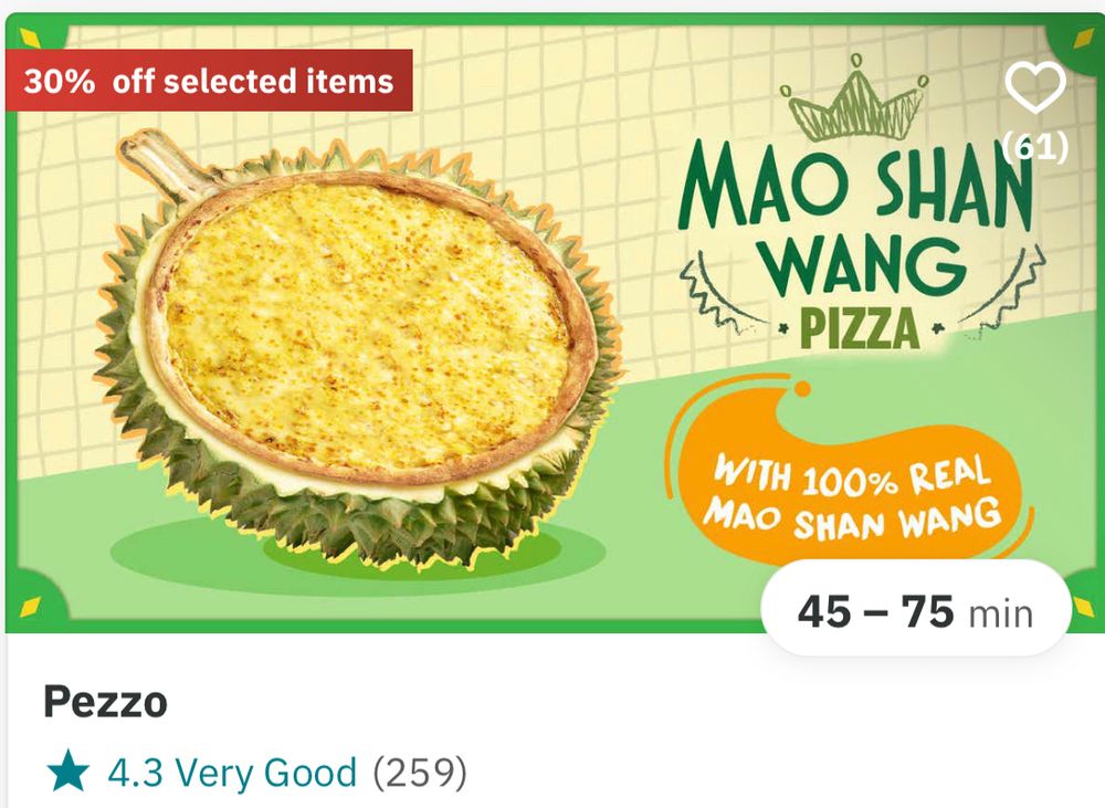 An ad for a Mao Shan Wang durian pizza “with 100% real Mao Shan Wang”, depicted a yellow pizza sitting in a split open durian shell. 