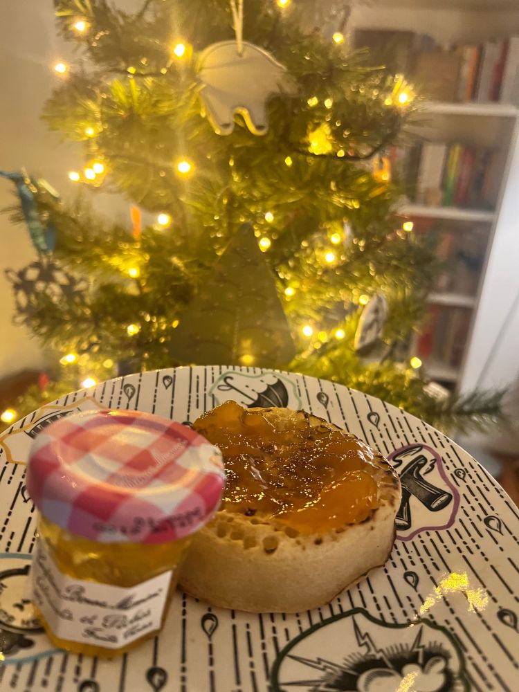 Apricot & Peach jam on a crumpet with a mini jam jar 