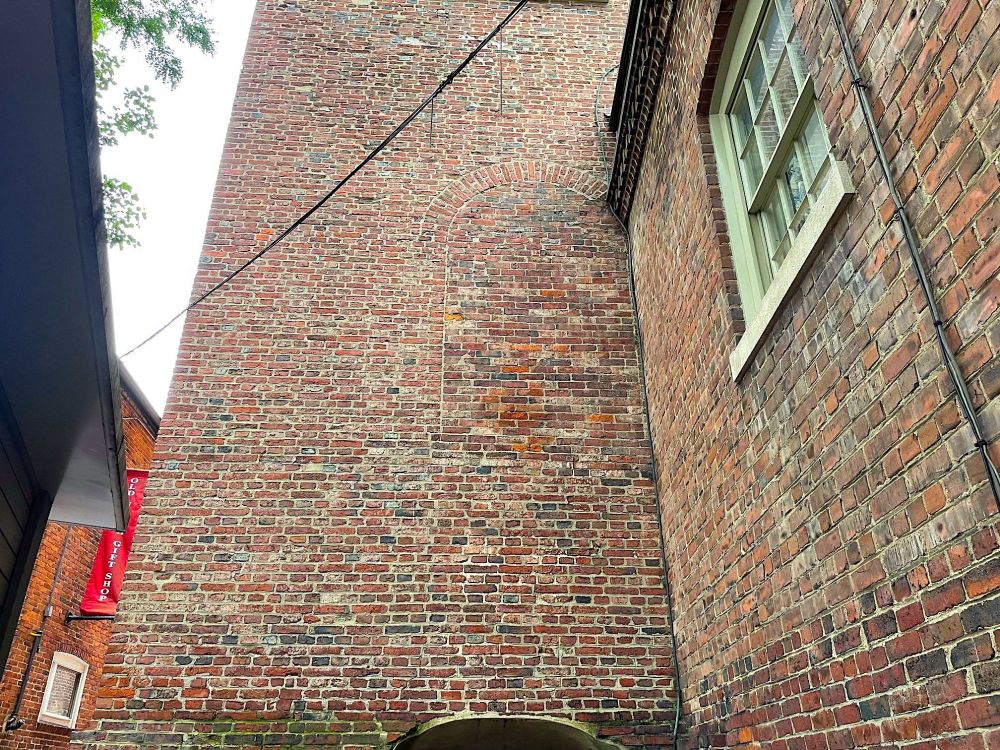 The outline of a door-shaped window on the exterior back wall of the Old North Church in Boston. 