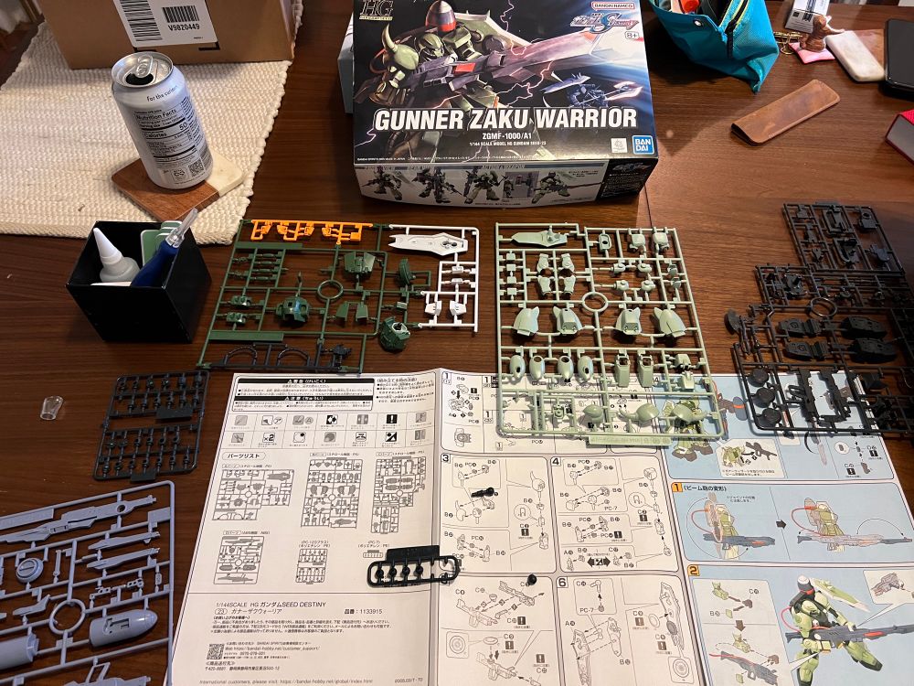 laid out parts for a gunner zaku warrior gunpla