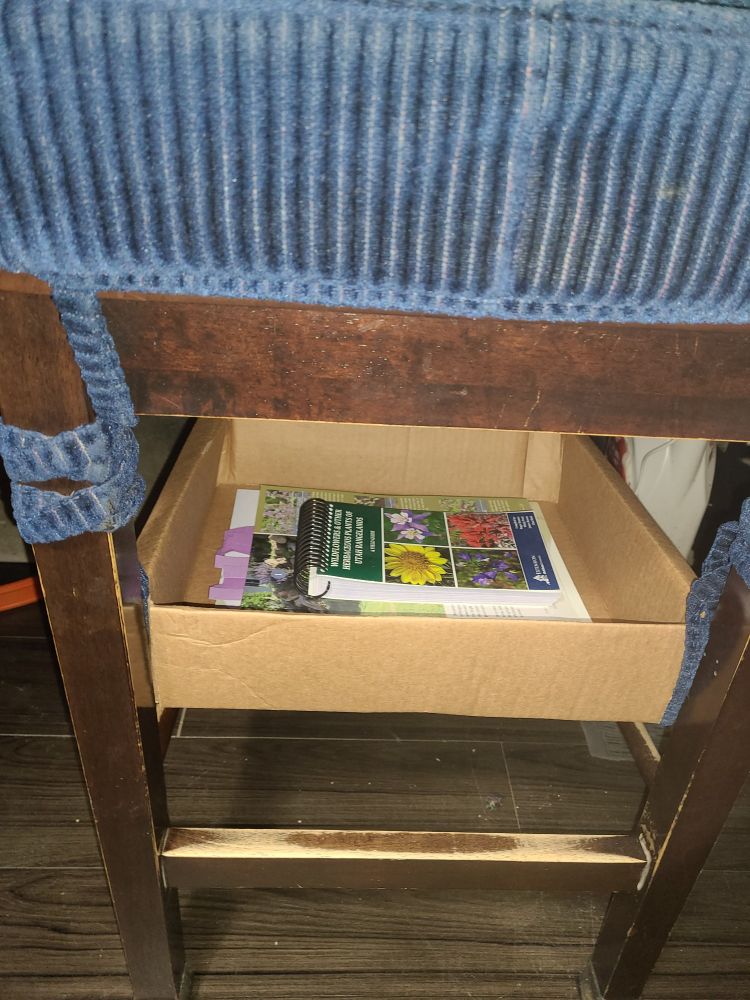 A close-up of the box and chair storage system 
