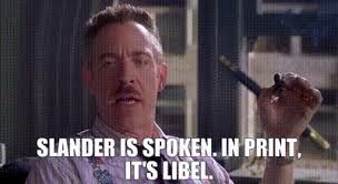 Photo of JK Simmonds as J Jonah Jameson in the 2002 Spider-Man film, holding a cigar. The photo is captioned: “Slander is spoken. In print it’s libel.”