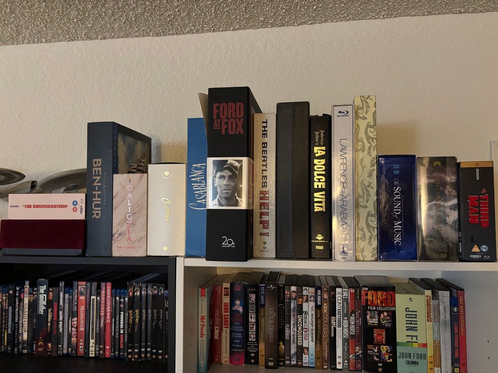 Stacks of DVDs and Blu-ray’s on a shelf.
