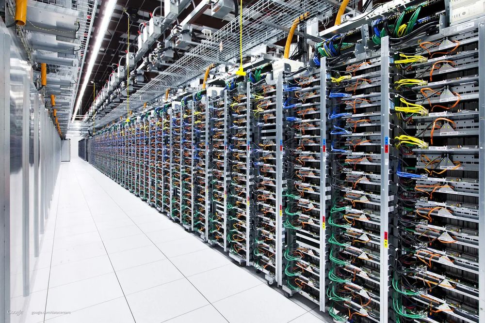 Rows of server racks inside one of Google's data centers.