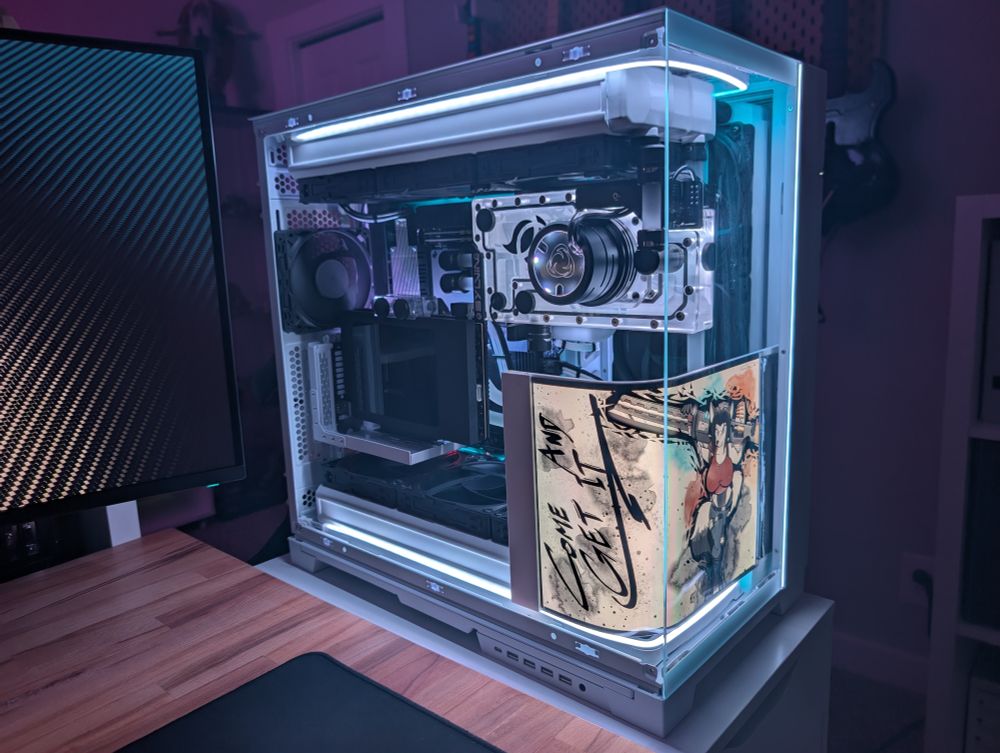 Close up of the gaming PC with an anthro cyborg fox on the internal curved display