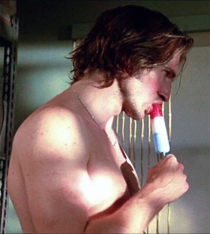 Screenshot of a guy eating a red white and blue popsicle 