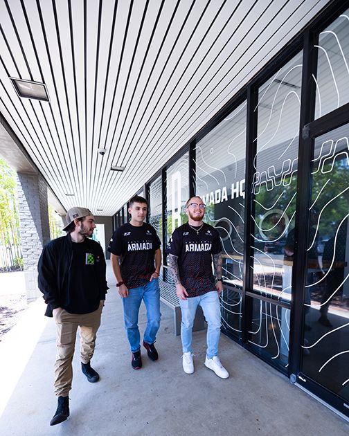 People walking on campus outside of Armada HQ