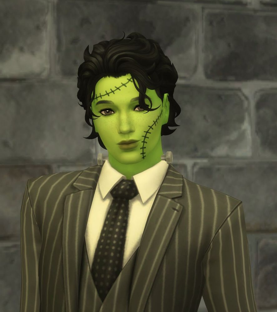 My simself dressed as Frankenstein's monster in a pinstripe suit with short black hair and green skin. 
