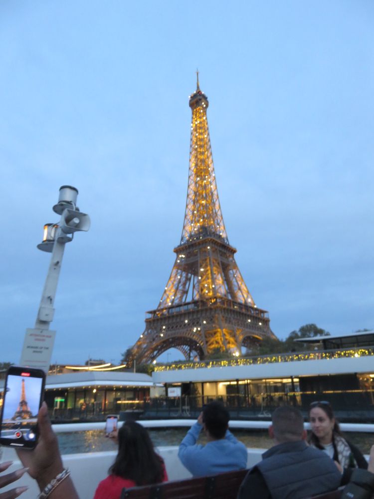 The Eiffel Tower beginning its evening light show.