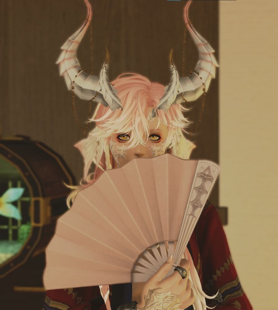 my transmasc au ra character from the game FFXIV. he has long pink/white hair and huge dragon horns. he is holding a fan in front of his face, his piercing yellow eyes peering over the fan.