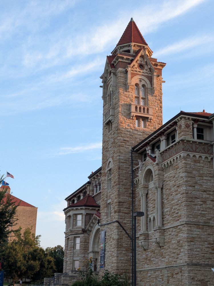 Tower of Dyche Hall, home of the KU Biodiversity Institute and Natural History Museum, in fading evening light.