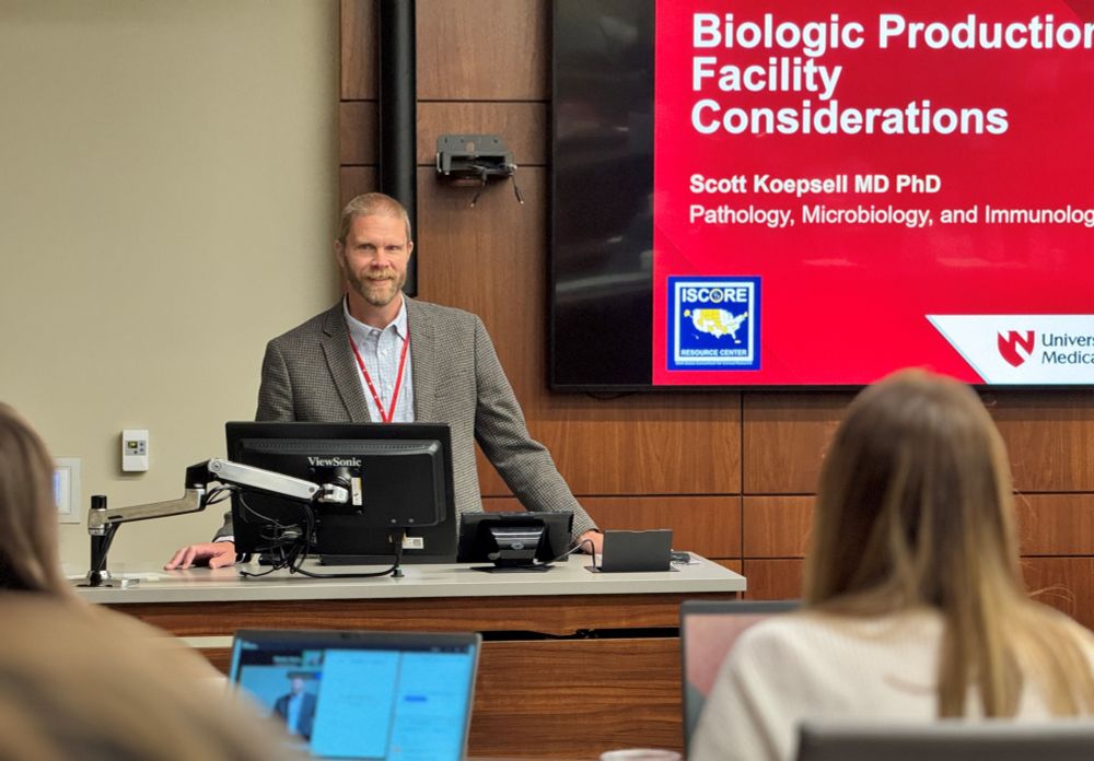 Dr. Scott Koepsell speaks to audience members from a podium