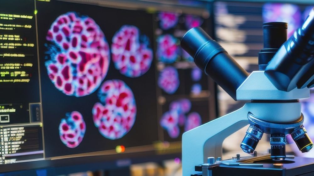 Microscope with computer screen in background