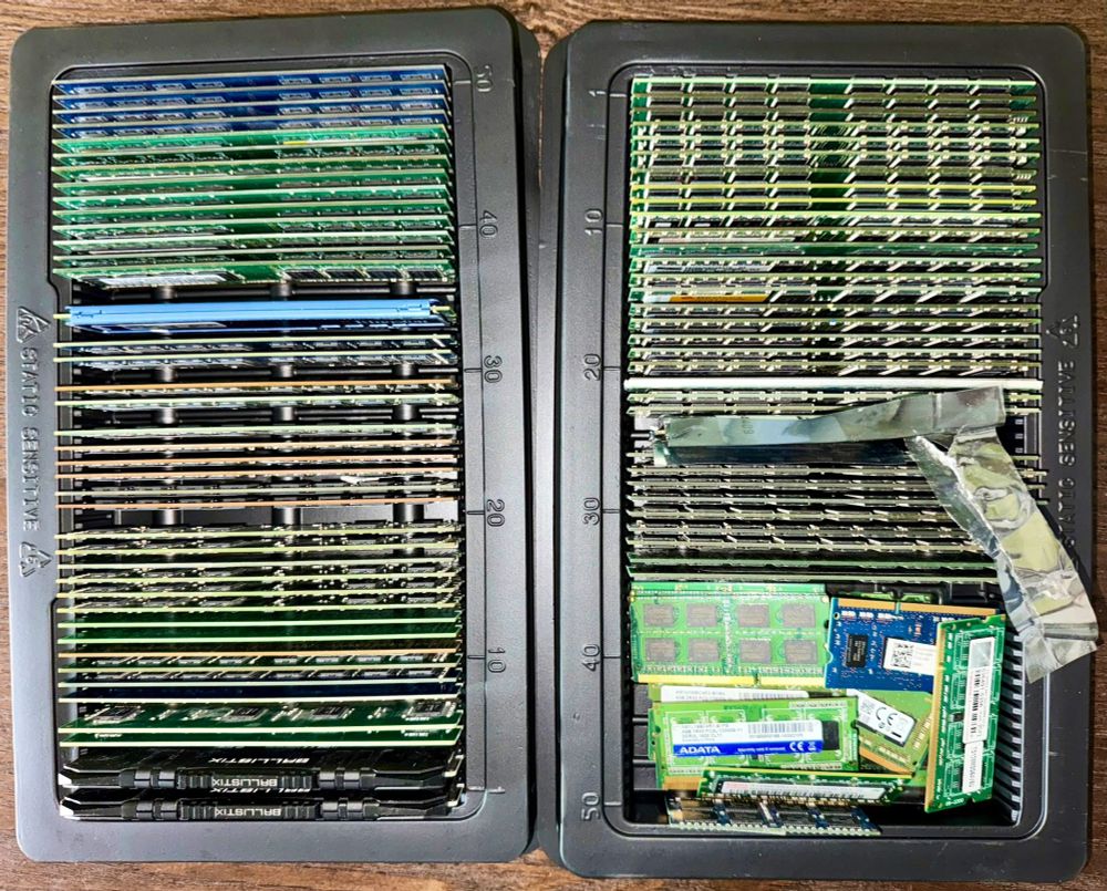 Bunch of computer memory sticks are stored in two memory storage trays.
